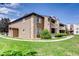 Condo building featuring green lawns, and a beautiful walkway at 10293 E Peakview Ave # F104, Englewood, CO 80111