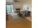 Cozy living room with fireplace, ceiling fan, and sliding glass doors to a patio overlooking a yard at 10293 E Peakview Ave # F104, Englewood, CO 80111