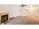 A spacious living area with fireplace that flows into the kitchen for seamless entertaining at 10293 E Peakview Ave # F104, Englewood, CO 80111