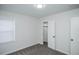 This bedroom features neutral paint, carpet, a window and a closet for storage at 4165 S Grant St, Englewood, CO 80113