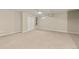 Spacious basement with neutral carpet, white trim, closet with shelving, and natural light at 63 S Holman Way, Golden, CO 80401