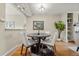 Comfortable dining room with a wooden table and seating for four at 63 S Holman Way, Golden, CO 80401