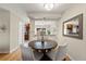 Dining room features a modern round table and seating for four at 63 S Holman Way, Golden, CO 80401
