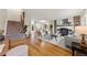 Spacious living room with hardwood floors, fireplace, and staircase at 63 S Holman Way, Golden, CO 80401