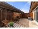 Fenced-in patio with cover, includes grill, air conditioning unit, and outdoor seating at 63 S Holman Way, Golden, CO 80401