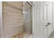Modern shower area with tiled walls, glass door and tiled floor design at 63 S Holman Way, Golden, CO 80401