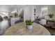 Modern dining area with wooden table and kitchen island view at 10306 Uvalda Ct, Commerce City, CO 80022