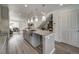 Modern kitchen with granite countertops and gray cabinets at 10306 Uvalda Ct, Commerce City, CO 80022