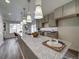 Modern kitchen with granite countertops and gray cabinets at 10306 Uvalda Ct, Commerce City, CO 80022