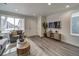 Open living room with wood floors and stylish decor at 10306 Uvalda Ct, Commerce City, CO 80022