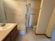 Bathroom featuring a vanity, toilet and shower with glass door at 2100 Robb St, Lakewood, CO 80215