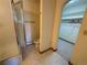 Bathroom featuring vanity, toilet, shower, and walk-in closet at 2100 Robb St, Lakewood, CO 80215