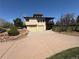 Charming home showcasing a two-car garage and attractive landscaping at 2100 Robb St, Lakewood, CO 80215