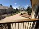 Charming front yard with mature trees and a well-maintained lawn, viewed from an elevated perspective at 2100 Robb St, Lakewood, CO 80215