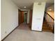 Open-concept living room with access to upper level at 2100 Robb St, Lakewood, CO 80215