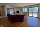 Inviting living room with a fireplace, wood floors, comfortable seating, and seamless access to the deck at 2100 Robb St, Lakewood, CO 80215