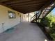 Covered patio with concrete flooring and access to the backyard at 2100 Robb St, Lakewood, CO 80215