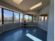 Sun-drenched sunroom featuring panoramic windows, skylights, and unique blue flooring for a cheerful atmosphere at 2100 Robb St, Lakewood, CO 80215