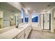 Large bathroom with double vanity, soaking tub, and separate shower at 8512 Orchard City Dr, Littleton, CO 80125