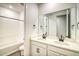 Bright bathroom with double vanity, soaking tub, and shower at 8512 Orchard City Dr, Littleton, CO 80125