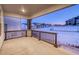 Covered porch with a view of a snow-covered neighborhood at 8512 Orchard City Dr, Littleton, CO 80125