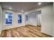 Bright dining room with hardwood floors and access to the kitchen at 8512 Orchard City Dr, Littleton, CO 80125