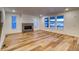 Spacious living room with hardwood floors and a modern fireplace at 8512 Orchard City Dr, Littleton, CO 80125