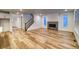 Bright and airy living room with hardwood floors and a fireplace at 8512 Orchard City Dr, Littleton, CO 80125