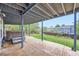 Under-deck patio with a hot tub and a view of the fenced-in grassy backyard at 1663 E 96Th Pl, Thornton, CO 80229