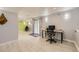 Finished basement with light wood flooring and a functional desk and office chair at 1663 E 96Th Pl, Thornton, CO 80229
