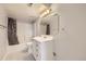 Bright, clean bathroom with white vanity, tiled floors, and shower-tub combination at 1663 E 96Th Pl, Thornton, CO 80229
