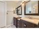 Bright bathroom featuring a double vanity at 1663 E 96Th Pl, Thornton, CO 80229