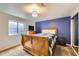 Cozy bedroom with a plaid comforter, wood sleigh bed frame, and recessed lighting at 1663 E 96Th Pl, Thornton, CO 80229