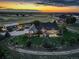 Scenic twilight aerial view of house showcasing lawn and landscaping and tranquil countryside at 34827 E 7Th Ave, Watkins, CO 80137