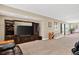 Spacious finished basement area featuring a TV and entertainment center at 34827 E 7Th Ave, Watkins, CO 80137
