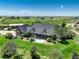 Charming home with lush landscaping, a patio, and expansive lawn creating a peaceful retreat at 34827 E 7Th Ave, Watkins, CO 80137