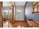 Inviting foyer with hardwood floors, a decorative front door, and ample natural light at 34827 E 7Th Ave, Watkins, CO 80137