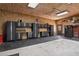 Large garage with built-in storage and workbench areas, offering ample space for vehicles and projects at 34827 E 7Th Ave, Watkins, CO 80137
