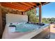 Close up shot of a luxurious hot tub on the back patio, perfect for relaxation at 34827 E 7Th Ave, Watkins, CO 80137