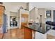 Kitchen offers granite countertops, stainless steel appliances, and seamless flow into other living spaces at 34827 E 7Th Ave, Watkins, CO 80137