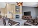 The living room features a fireplace and vaulted ceilings, creating a warm and inviting atmosphere at 34827 E 7Th Ave, Watkins, CO 80137