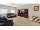 Cozy basement living space featuring a TV and entertainment center at 34827 E 7Th Ave, Watkins, CO 80137
