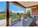 Cozy porch with comfortable seating and scenic views of the open landscape beyond at 34827 E 7Th Ave, Watkins, CO 80137