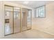 Basement with carpet and mirrored closet doors at 4395 E Arapahoe Pl, Centennial, CO 80122