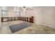 Basement with carpet, storage shelves, and ceiling fan at 4395 E Arapahoe Pl, Centennial, CO 80122