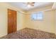 Cozy bedroom features a window and wood door at 4395 E Arapahoe Pl, Centennial, CO 80122