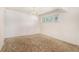 Bedroom with white walls, overhead lighting, and a window at 4395 E Arapahoe Pl, Centennial, CO 80122