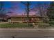 Charming single-story brick home with well-maintained front lawn and inviting front porch at 4395 E Arapahoe Pl, Centennial, CO 80122