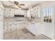 Bright kitchen featuring all-white cabinetry, and tile flooring at 4395 E Arapahoe Pl, Centennial, CO 80122