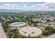 Aerial view of a neighborhood park with playground, sports area, and residential surroundings at 32 Whitehaven Cir, Highlands Ranch, CO 80129